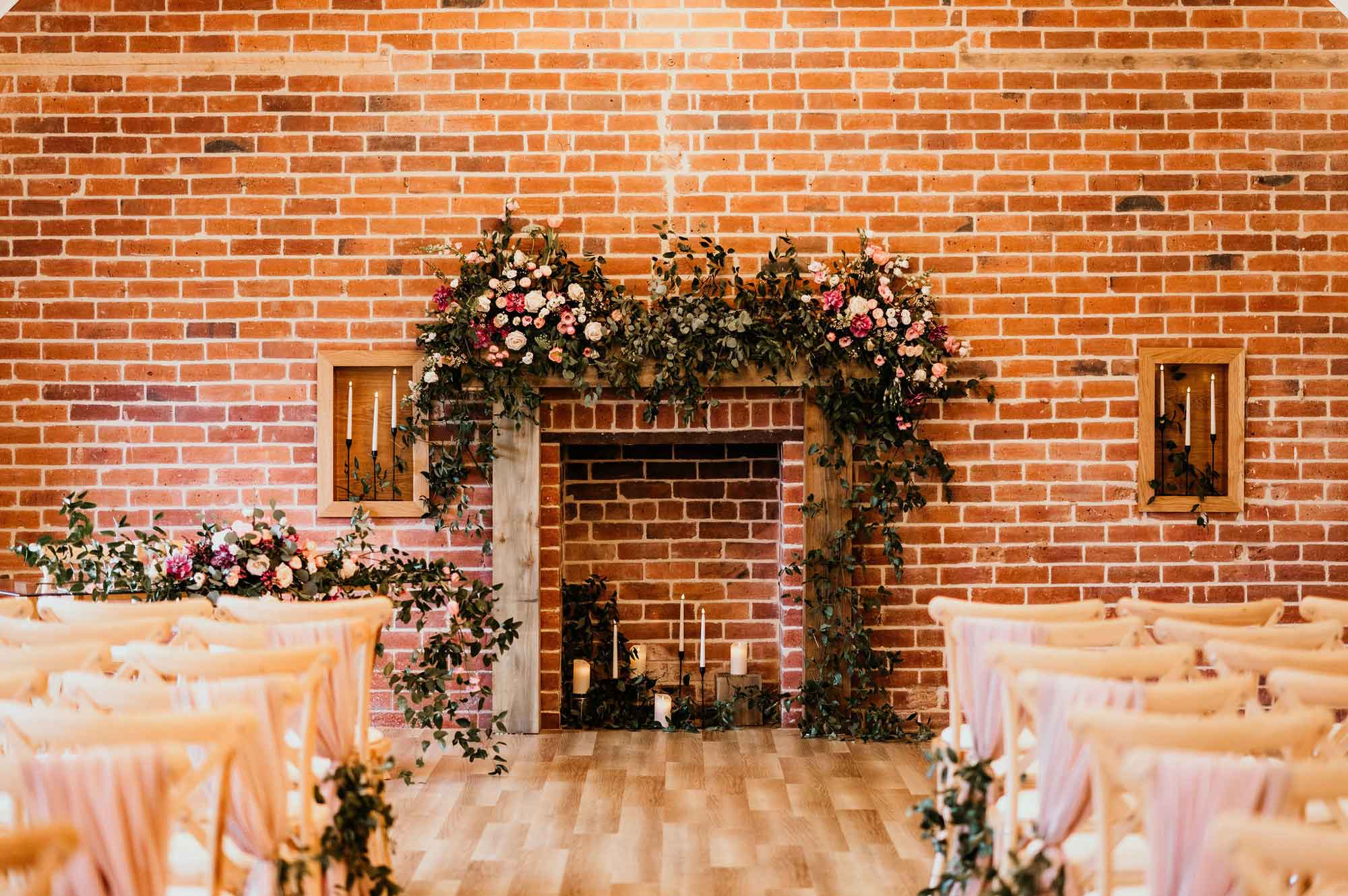The ceremony fireplace dressed with flowers